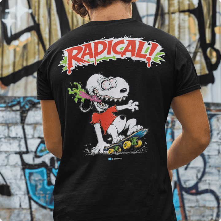 Rear view of a man wearing a black t-shirt with a screaming Snoopy Dog in an Ed Roth style in an urban setting.
