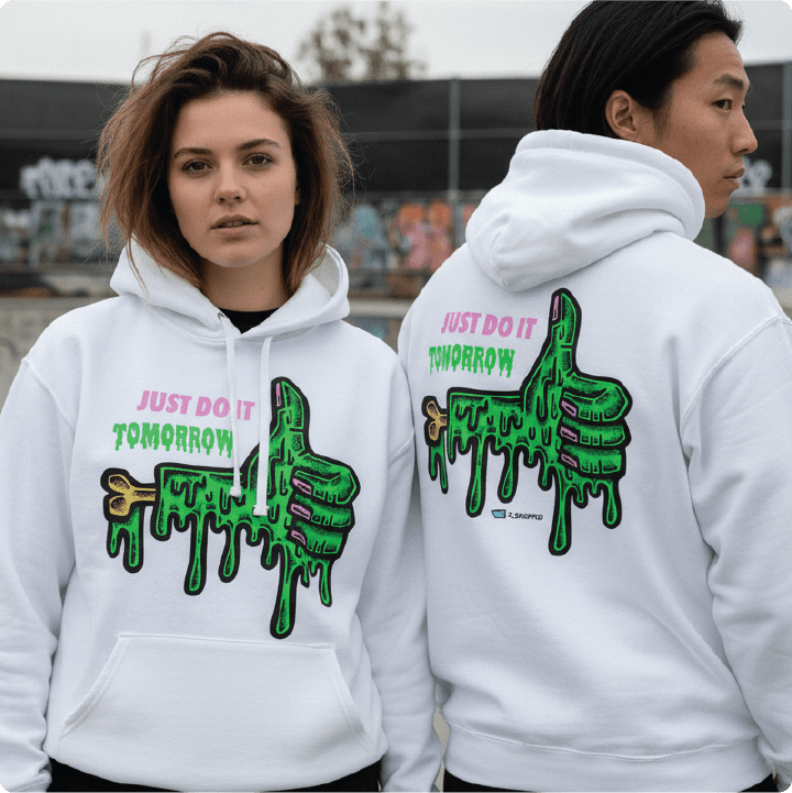 Two people wearing white hoodies with green and pink graphics and text.