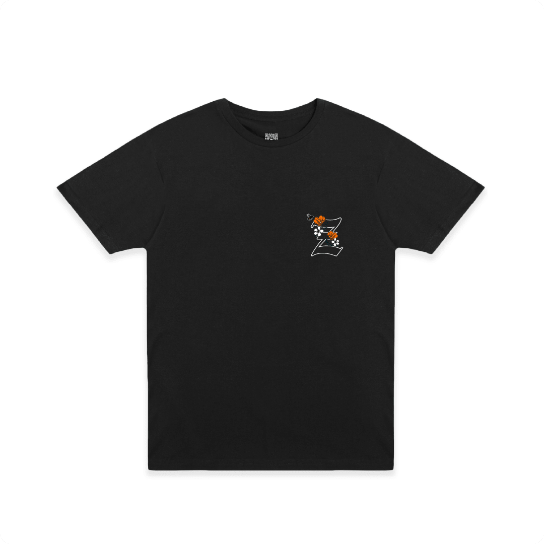 Front view of a black t-shirt with a small California poppy and 'Z' design on a white background