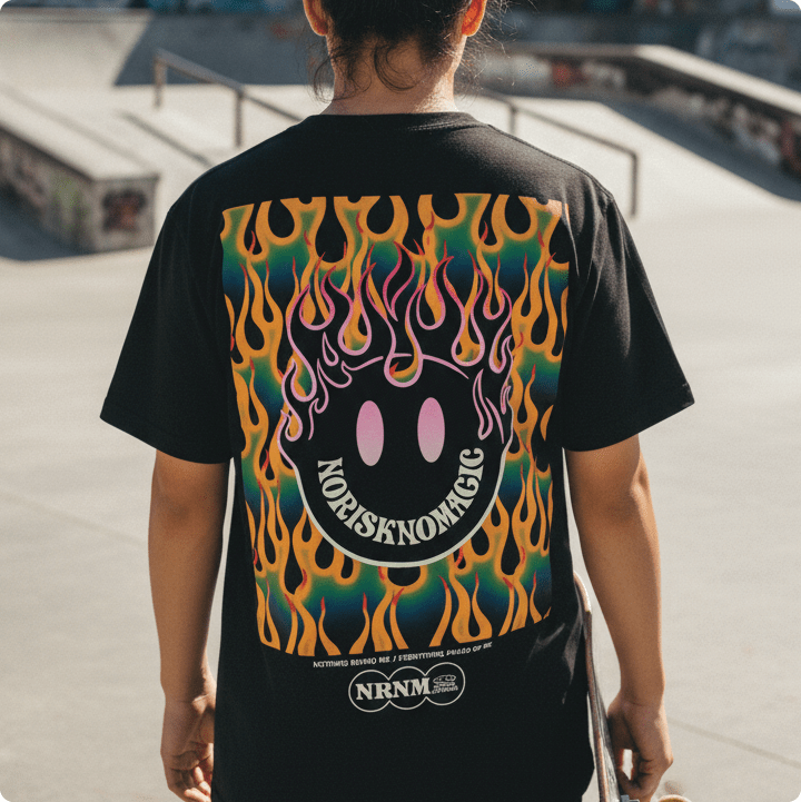 rear view of a young man wearing a no risk no magic t-shirt at a skatepark