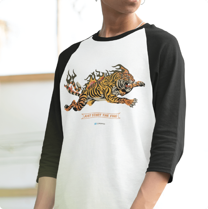 Person wearing a baseball shirt with a tiger graphic and text on a white background