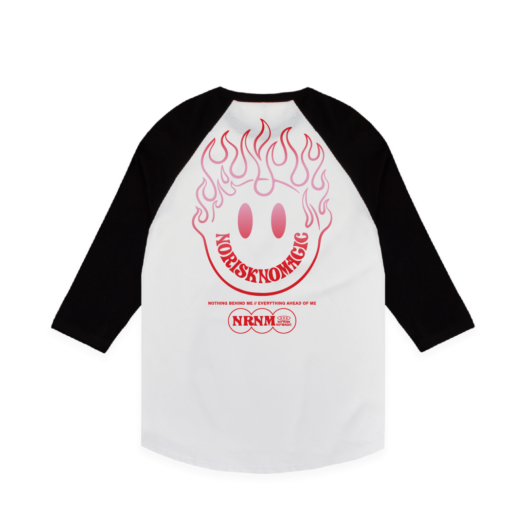 White baseball shirt with black sleeves featuring a red happy face and flames on a white background