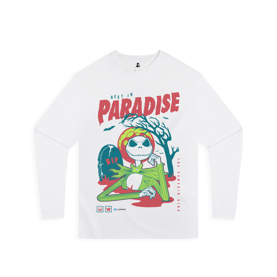 White long-sleeve shirt with a colorful graphic design featuring a character and 'Best in Paradise' text on a white background.