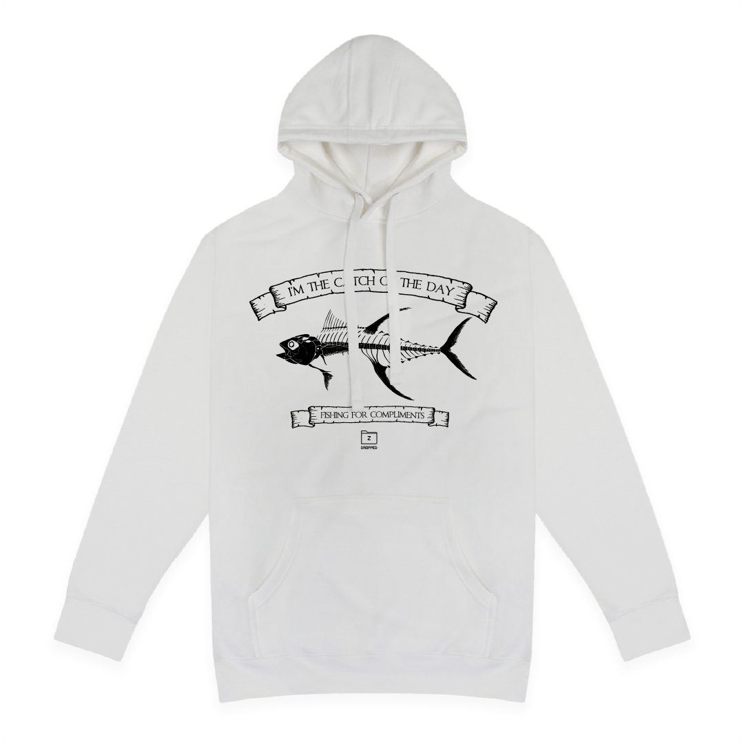 Front view of a unisex white hoodie with large black tuna bones graphic on a white background with black text that reads "I'm the catch of the day" on the top of the fish graphic and "fishing for compliments" in black text below the graphic
