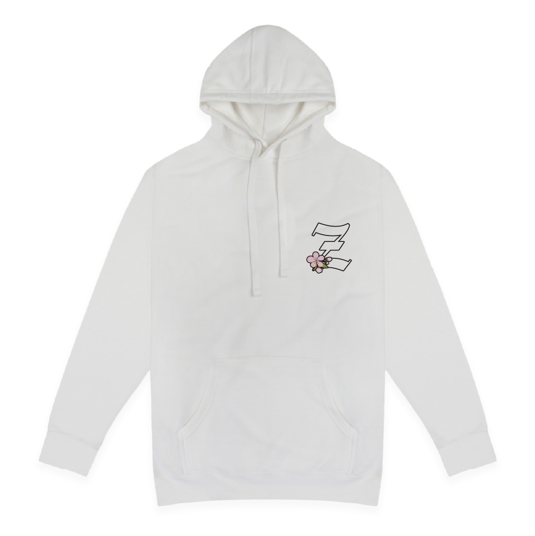 Front view of a white hoodie with a small Z logo with a cherry blossom on the chest against a white background