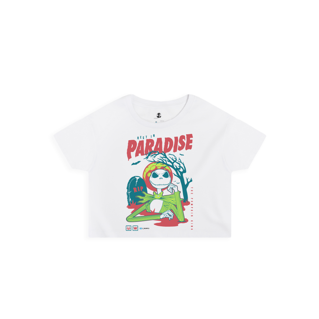 Front view of a womens white crop top shirt with a colorful skeleton graphic featuring a 'Rest in Paradise' text on a white background.