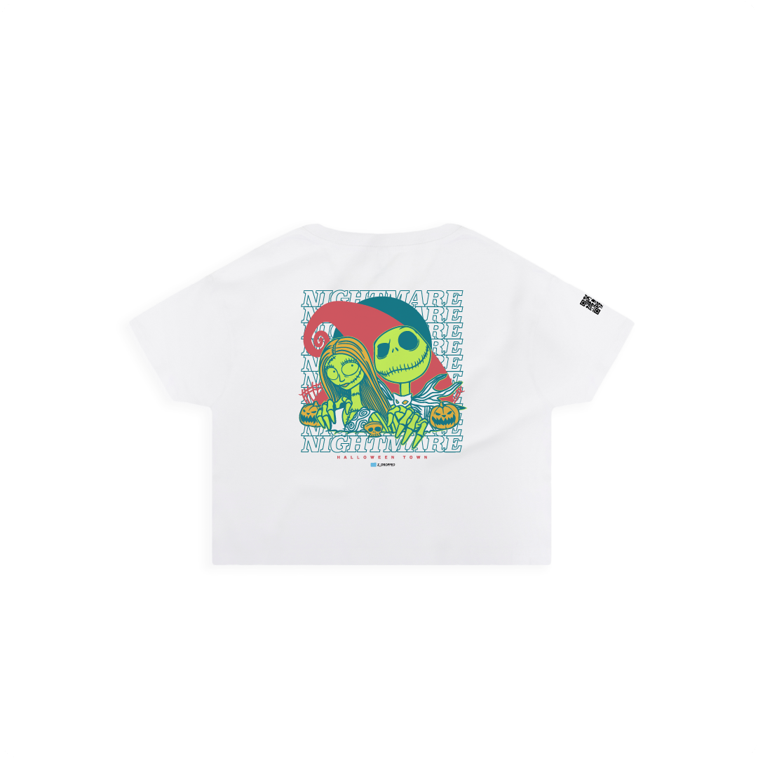 Rear view of a womens white crop top with neon cartoon skeletons and 'NIGHTMARE' text on a white background.
