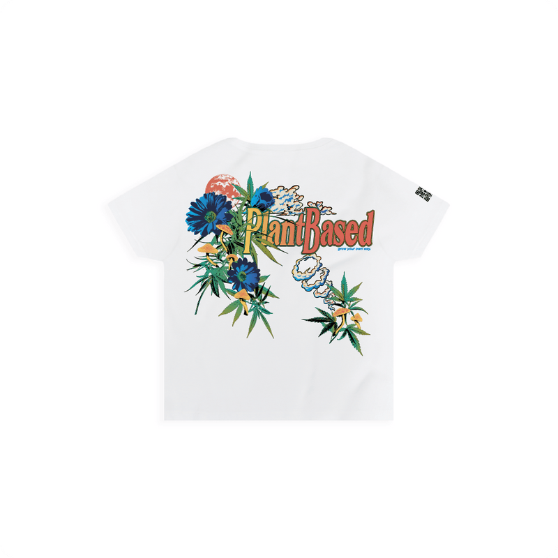 Rear view of a woman's white high waisted t-shirt with a botanical and cannabis-inspired design, featuring the text 'Plant Based' in bold colorful lettering and various plants and mushrooms.
