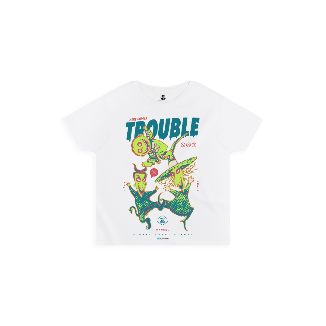 Front view of a white high waisted tee with colorful lock shock and barrel and 'Here Comes Trouble' text on a white background