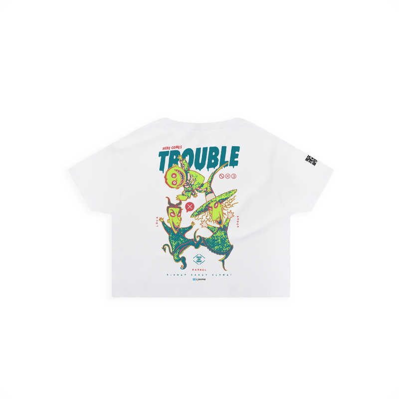 Rear view of a white crop top with colorful lock shock and barrel and 'Here Comes Trouble' text on a white background