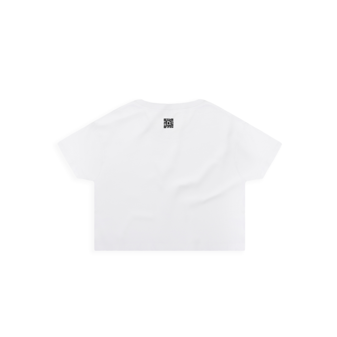 Rear view of a women's white crop top with a small black zdropped QR code on a white background