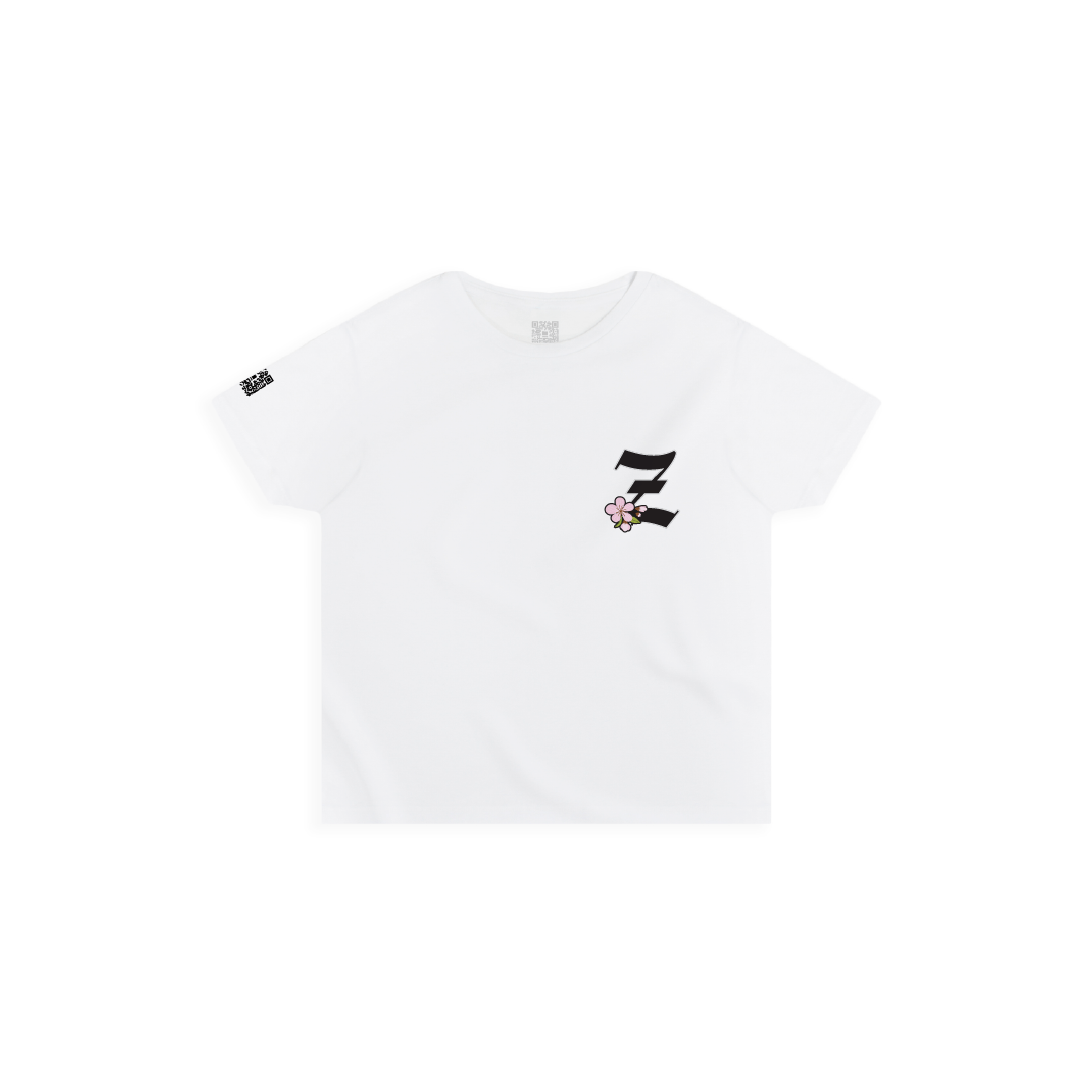 Front view of a women's white high waisted t-shirt with a small black 'Z' logo and pink cherry blossom flower on a white background