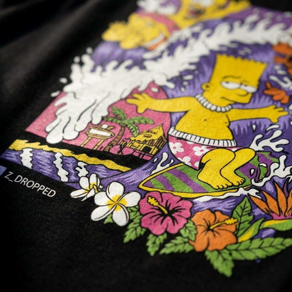close up detail of colorful bart simpson surfing on a wave on a black tank top