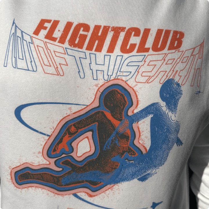 Detailed up close print quality shot of 'FLIGHTCLUB' and 'NOT OF THIS EARTH' text.