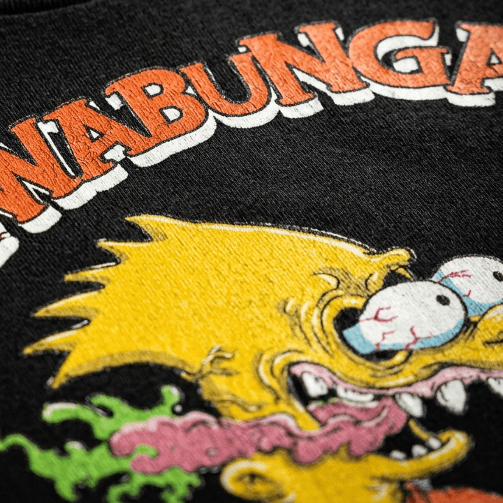 close up shot of bar roth print detail on a black t-shirt