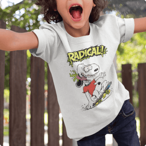 Child wearing a white t-shirt with a Snoopy graphic and the word 'RADICAL!' at an outdoor playground.